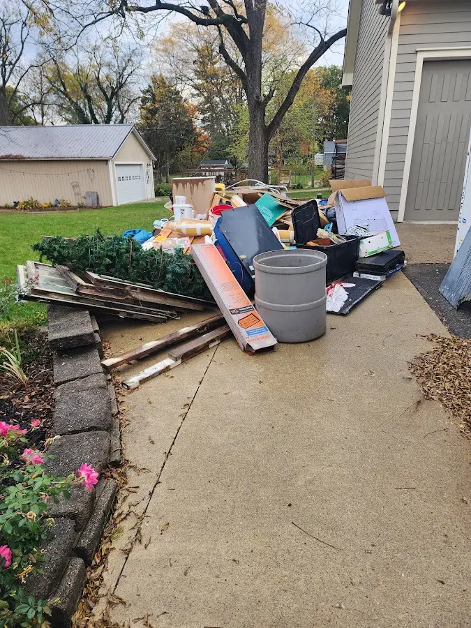Dumpster being loaded with debris for 3 Yard Dumpster Rental in Ellwood City
